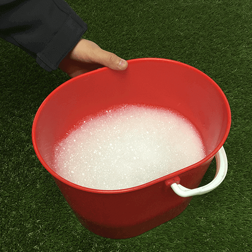 Cleaning your artificial grass with warm soapy water
